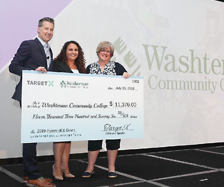 WCC’s Laura Crane (far right) accepts the Power of X grant during the 2019 TargetX Summit in New Orleans.