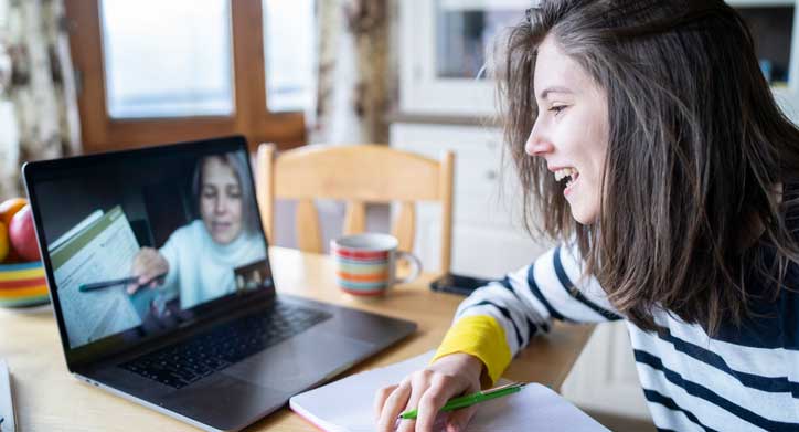 student getting help with a mentor via virtual meeting