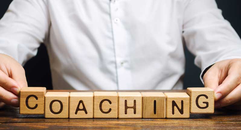 block letters spelling coaching